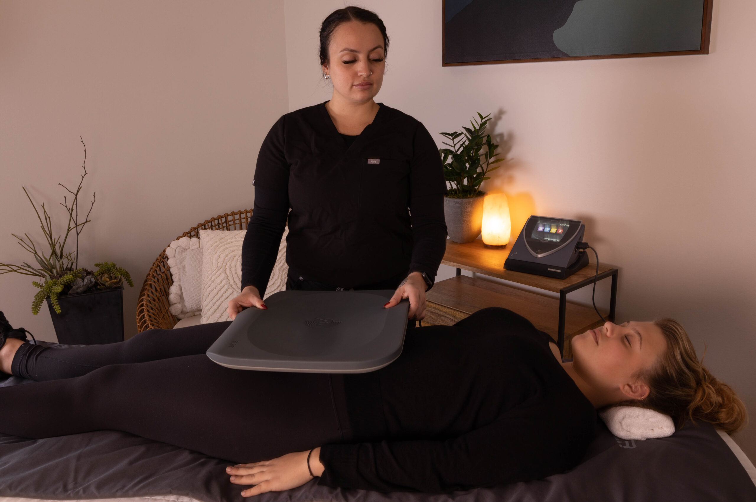 Two ladies using PEMF therapy at Ascent Adaptation and Regeneration
